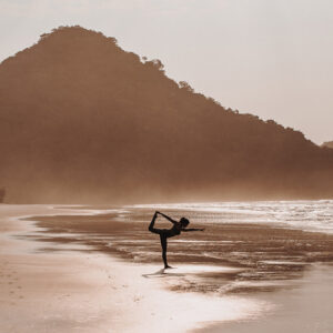 Dancers pose on the beach